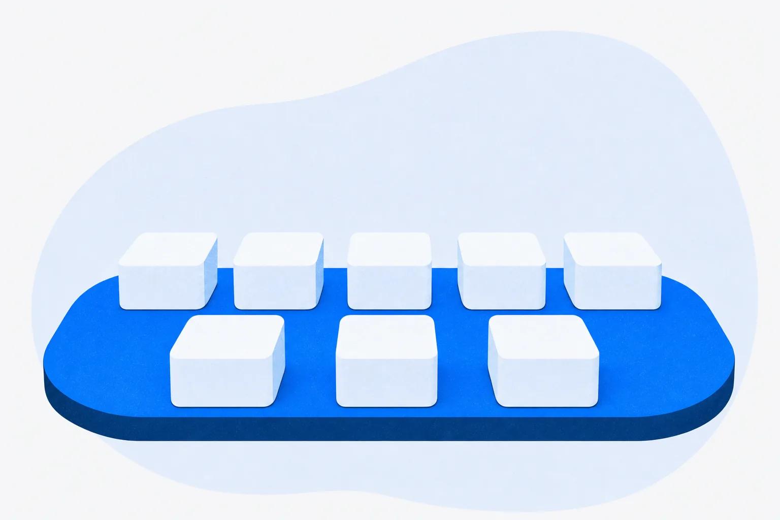 A tray of eight blocks with three pushed forward, standing for the features you actually use in year one